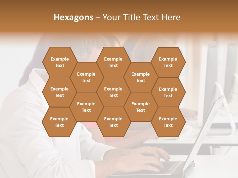 A Group Of People Sitting At A Table With Computers PowerPoint Template