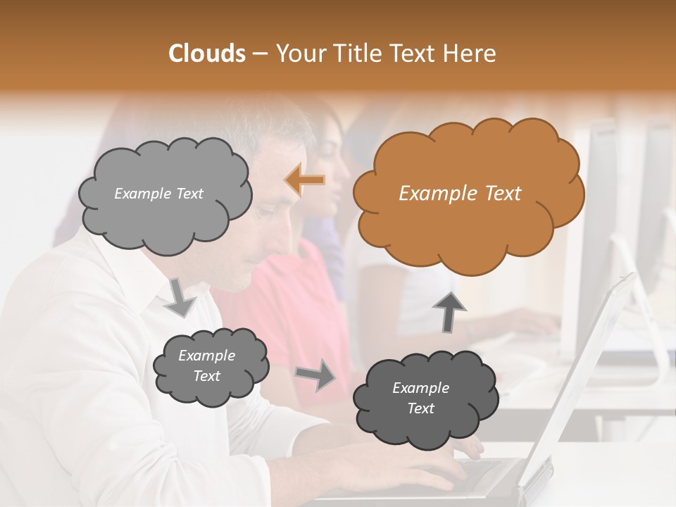 A Group Of People Sitting At A Table With Computers PowerPoint Template