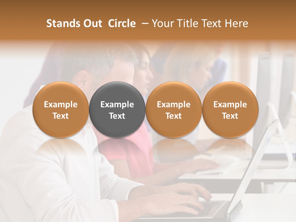 A Group Of People Sitting At A Table With Computers PowerPoint Template