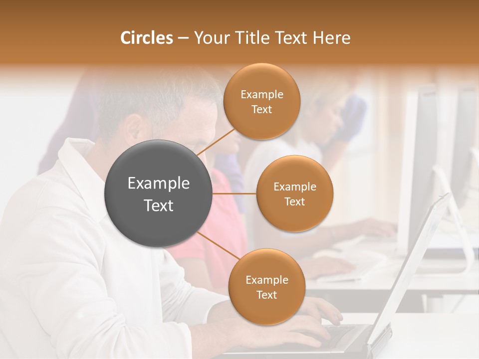 A Group Of People Sitting At A Table With Computers PowerPoint Template