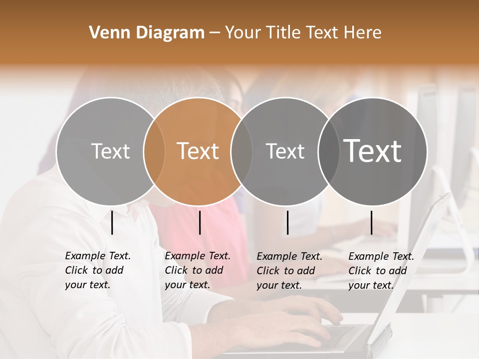 A Group Of People Sitting At A Table With Computers PowerPoint Template