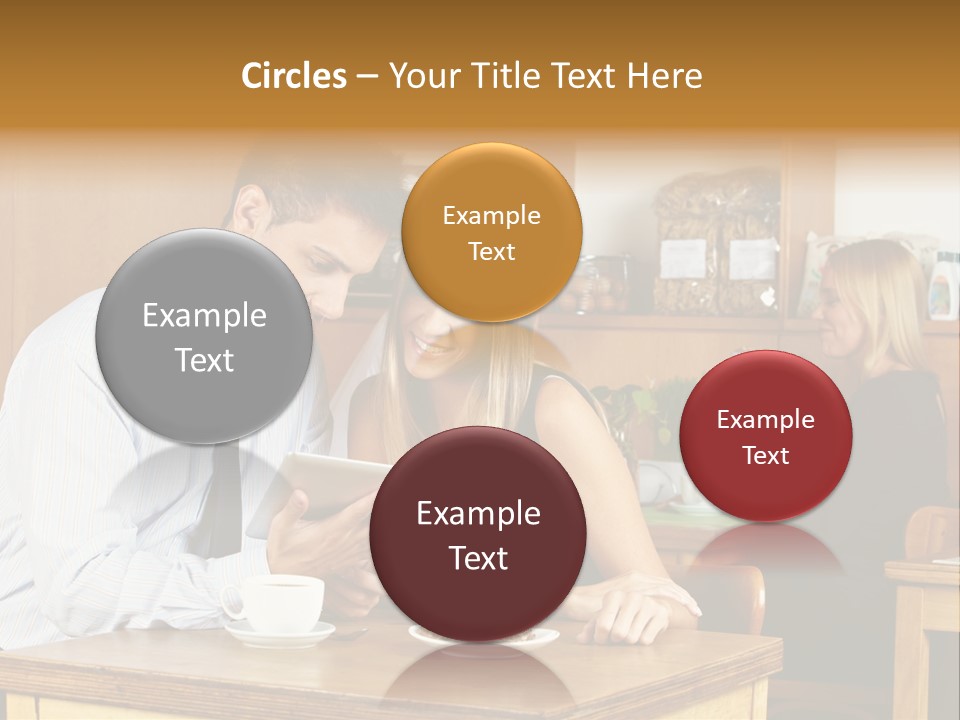 A Man And Woman Sitting At A Table Looking At A Tablet PowerPoint Template