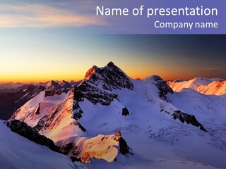 A Snowy Mountain With A Sunset In The Background PowerPoint Template
