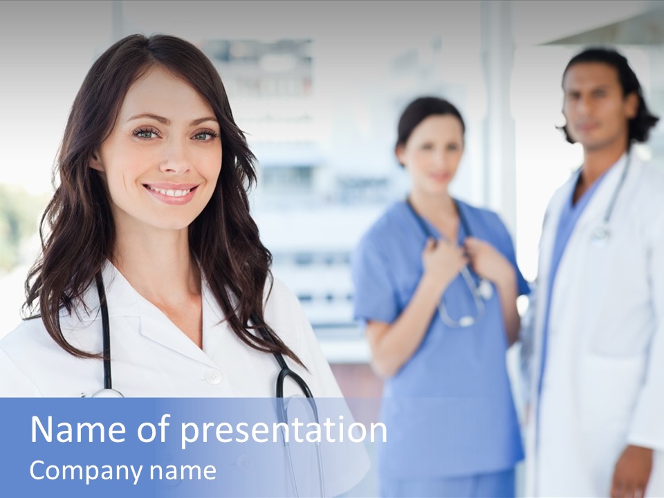 A Group Of Doctors Standing In A Hospital PowerPoint Template