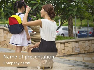 A Woman Kneeling Down Next To A Little Girl PowerPoint Template