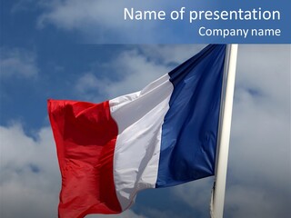 A Flag Is Flying In The Wind On A Cloudy Day PowerPoint Template