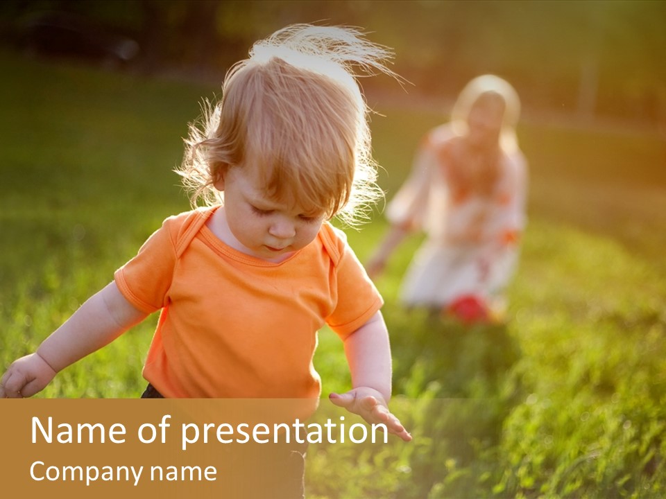 Two Children Are Playing In A Field Of Grass PowerPoint Template