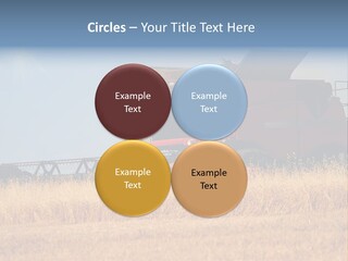 A Big Red Truck Is Driving Through A Field PowerPoint Template