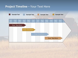 A Big Red Truck Is Driving Through A Field PowerPoint Template