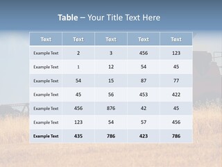 A Big Red Truck Is Driving Through A Field PowerPoint Template