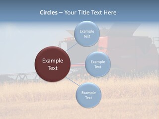 A Big Red Truck Is Driving Through A Field PowerPoint Template