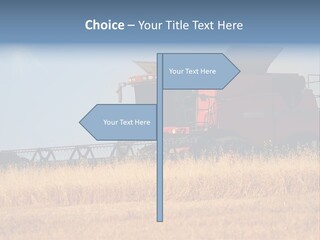 A Big Red Truck Is Driving Through A Field PowerPoint Template