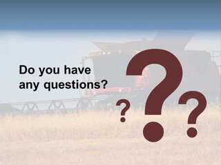 A Big Red Truck Is Driving Through A Field PowerPoint Template
