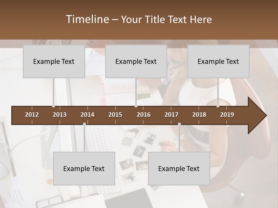 A Man And A Woman Sitting At A Desk Working On A Laptop PowerPoint Template