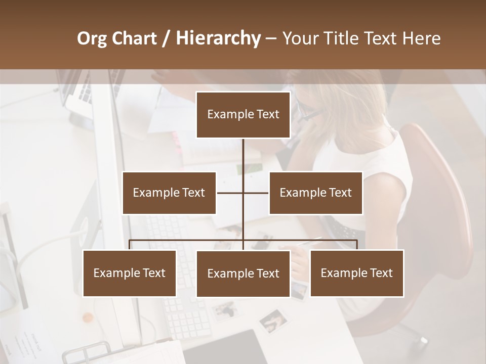A Man And A Woman Sitting At A Desk Working On A Laptop PowerPoint Template