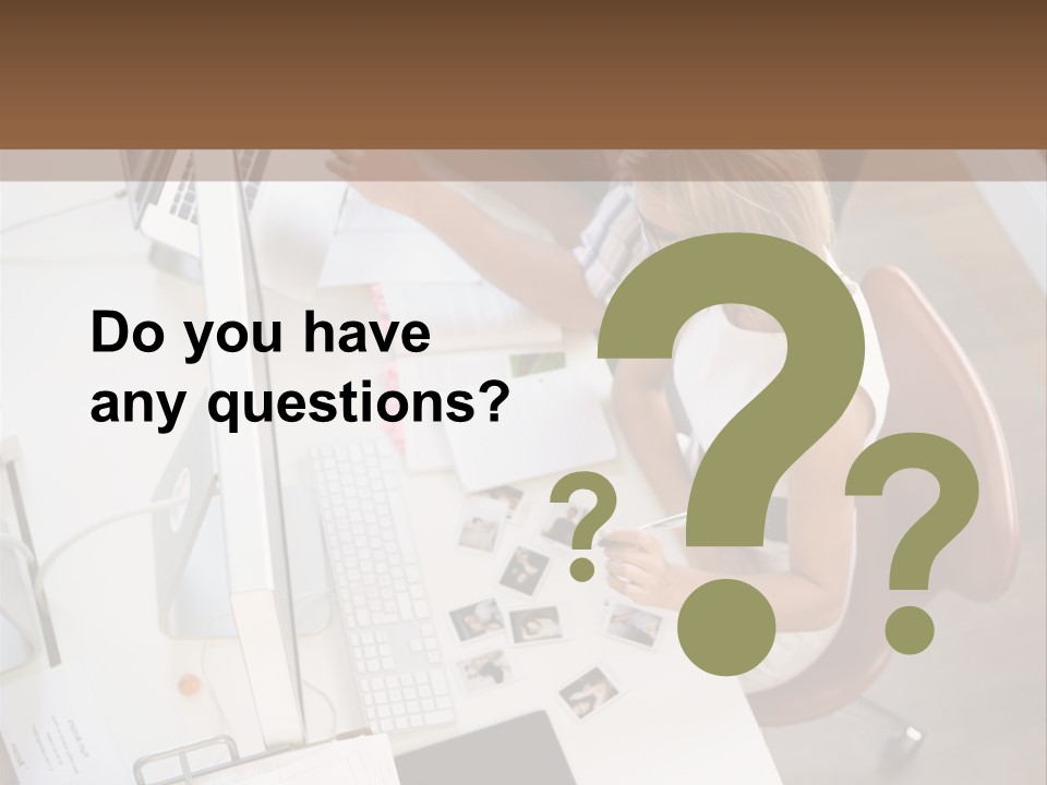 A Man And A Woman Sitting At A Desk Working On A Laptop PowerPoint Template