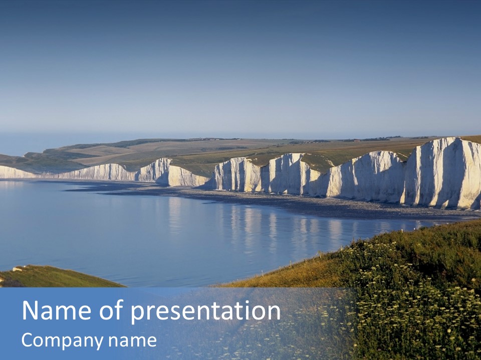 A Large Body Of Water Surrounded By White Cliffs PowerPoint Template