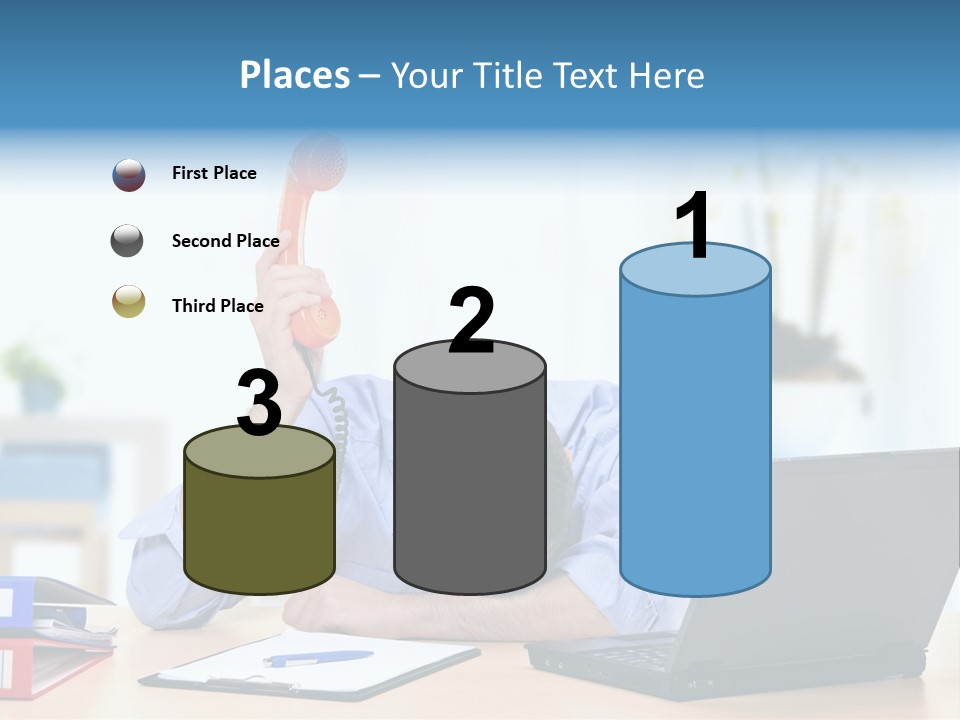 A Man Sitting At A Desk With A Laptop And Telephone PowerPoint Template