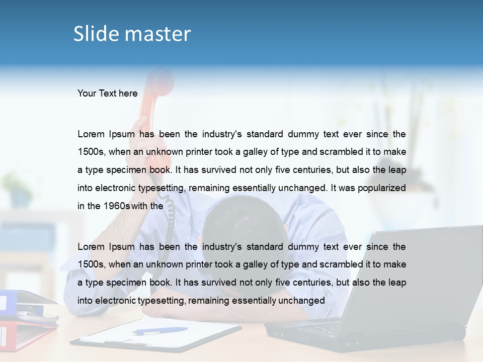 A Man Sitting At A Desk With A Laptop And Telephone PowerPoint Template