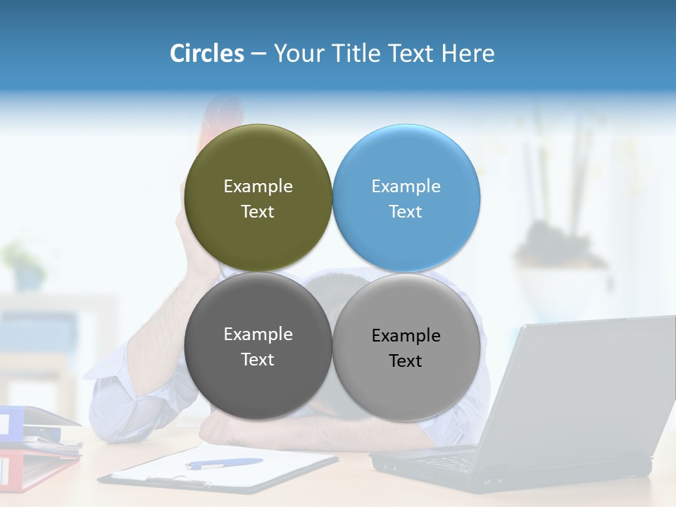 A Man Sitting At A Desk With A Laptop And Telephone PowerPoint Template