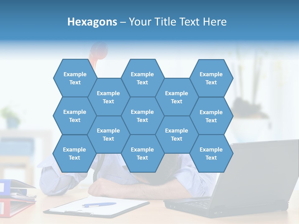 A Man Sitting At A Desk With A Laptop And Telephone PowerPoint Template