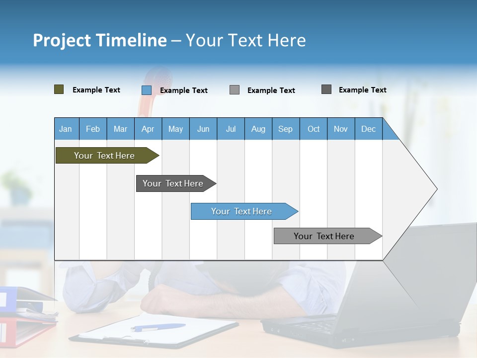 A Man Sitting At A Desk With A Laptop And Telephone PowerPoint Template