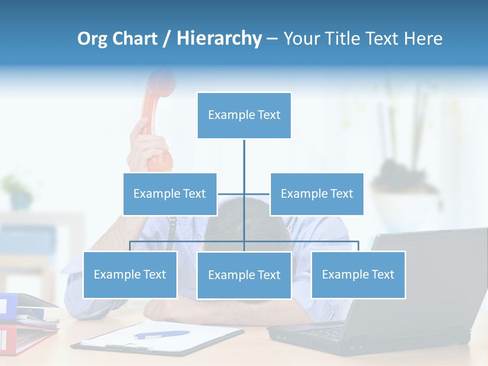 A Man Sitting At A Desk With A Laptop And Telephone PowerPoint Template