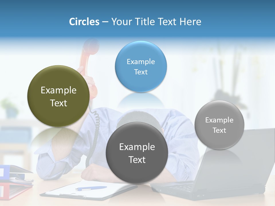 A Man Sitting At A Desk With A Laptop And Telephone PowerPoint Template