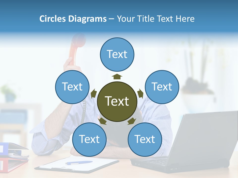 A Man Sitting At A Desk With A Laptop And Telephone PowerPoint Template
