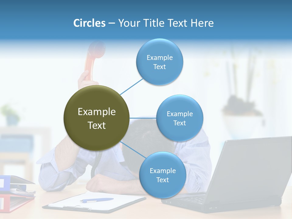 A Man Sitting At A Desk With A Laptop And Telephone PowerPoint Template