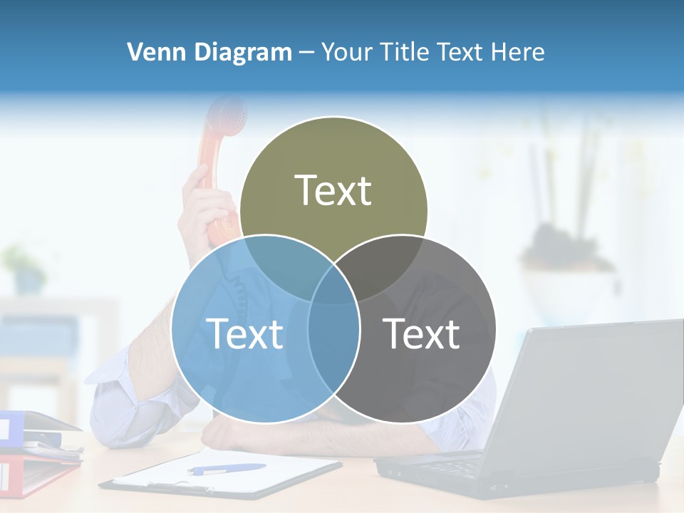 A Man Sitting At A Desk With A Laptop And Telephone PowerPoint Template