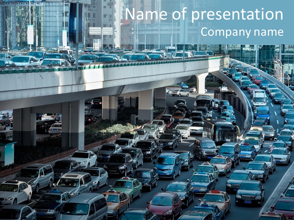 A Highway Filled With Lots Of Traffic Next To Tall Buildings PowerPoint Template