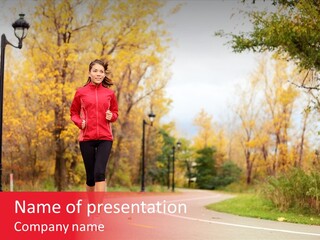 A Woman Running Down A Road In A Red Jacket PowerPoint Template