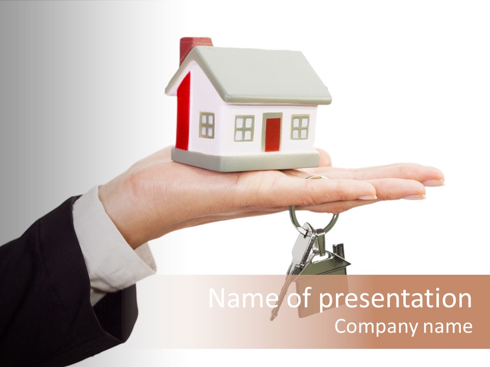 A Person Holding A House Key In Their Hand PowerPoint Template