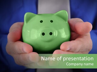 A Person Holding A Green Piggy Bank In Their Hands PowerPoint Template