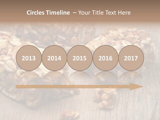 A Wooden Table Topped With Granola And Nuts PowerPoint Template