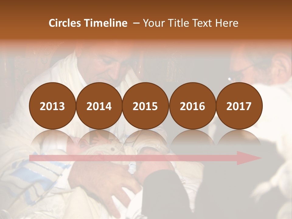 A Man Is Holding A Baby In His Lap PowerPoint Template