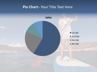 A Woman Standing On A Paddle Board In The Water PowerPoint Template