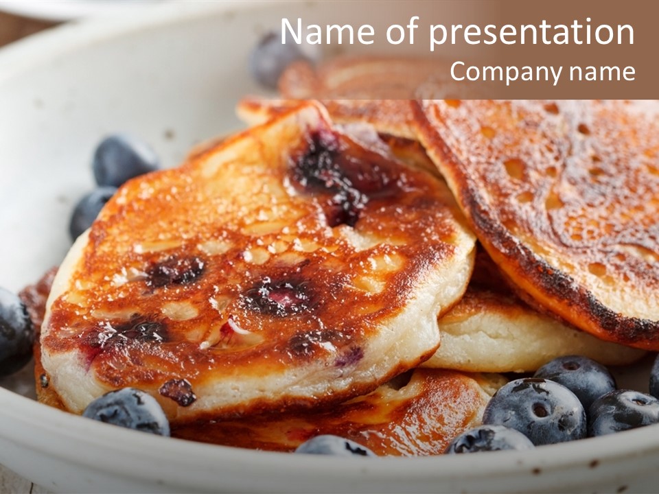 A White Bowl Filled With Pancakes And Blueberries PowerPoint Template
