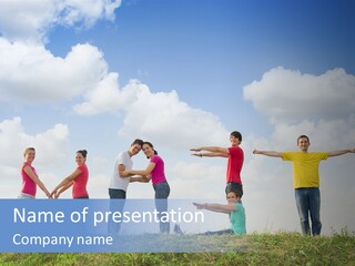 A Group Of People Standing On Top Of A Grass Covered Field PowerPoint Template