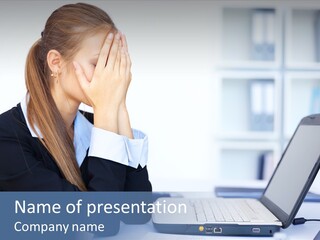 A Woman Sitting At A Desk Covering Her Face With Her Hands PowerPoint Template