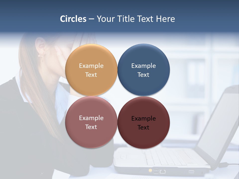 A Woman Sitting At A Desk Covering Her Face With Her Hands PowerPoint Template