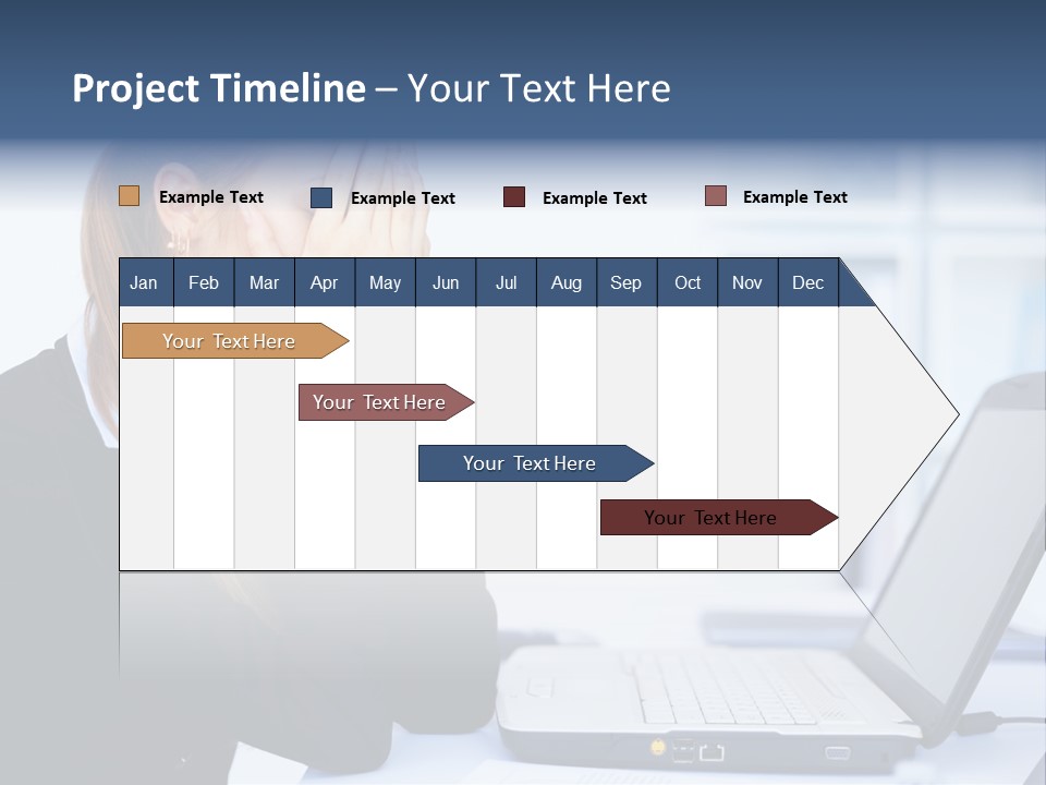 A Woman Sitting At A Desk Covering Her Face With Her Hands PowerPoint Template