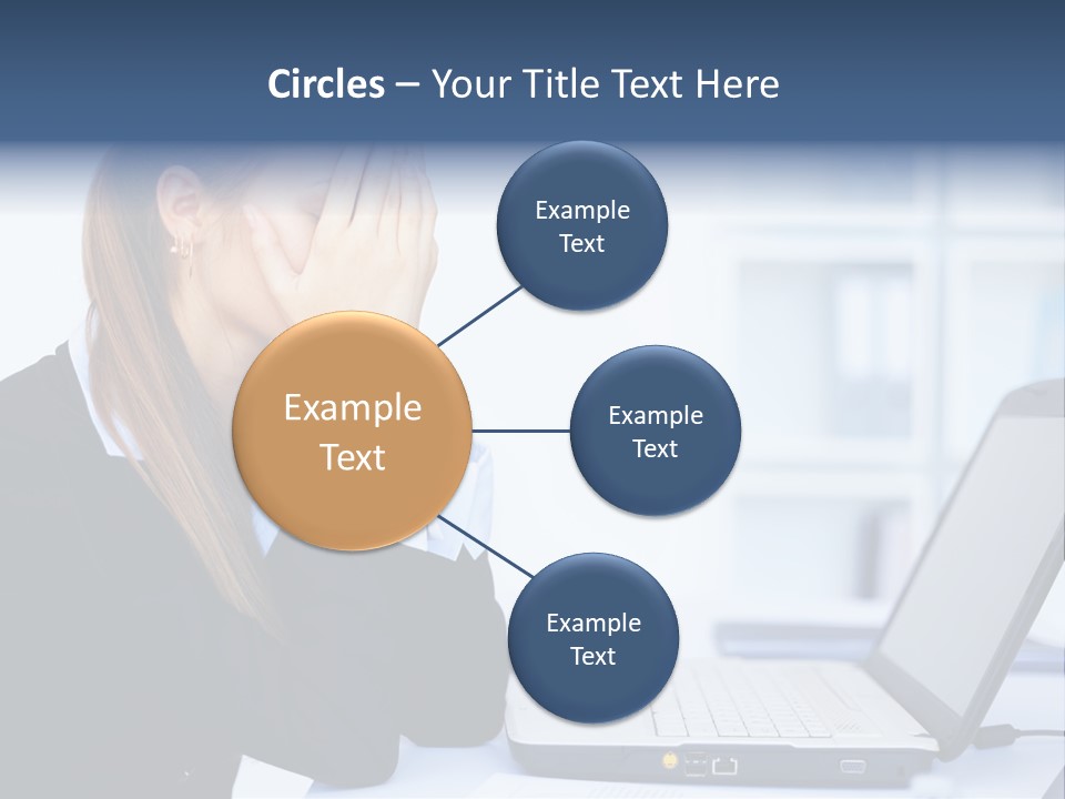 A Woman Sitting At A Desk Covering Her Face With Her Hands PowerPoint Template
