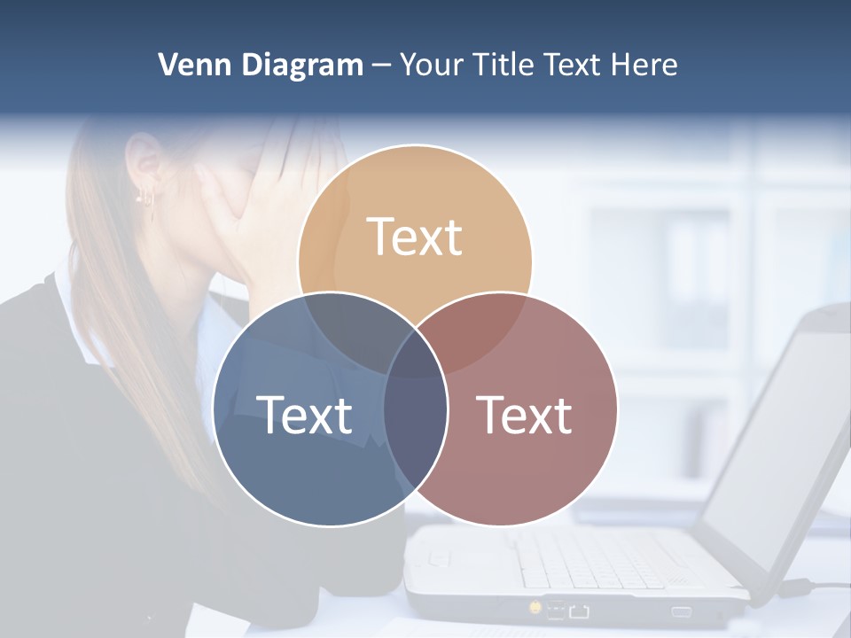 A Woman Sitting At A Desk Covering Her Face With Her Hands PowerPoint Template