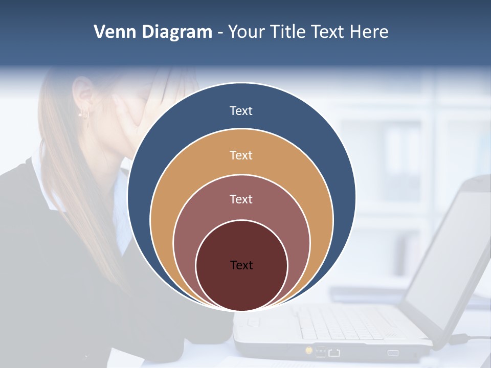 A Woman Sitting At A Desk Covering Her Face With Her Hands PowerPoint Template