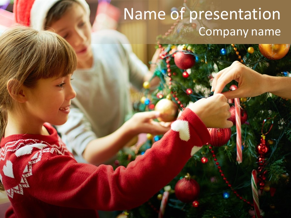 A Young Girl Is Decorating A Christmas Tree PowerPoint Template