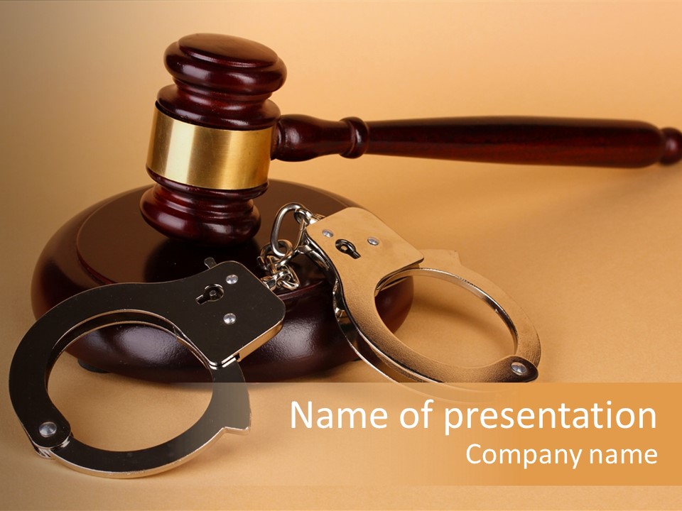 A Judge's Hammer And Handcuffs On Top Of A Table PowerPoint Template