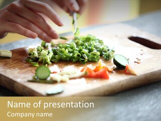 A Person Chopping Vegetables On A Cutting Board PowerPoint Template