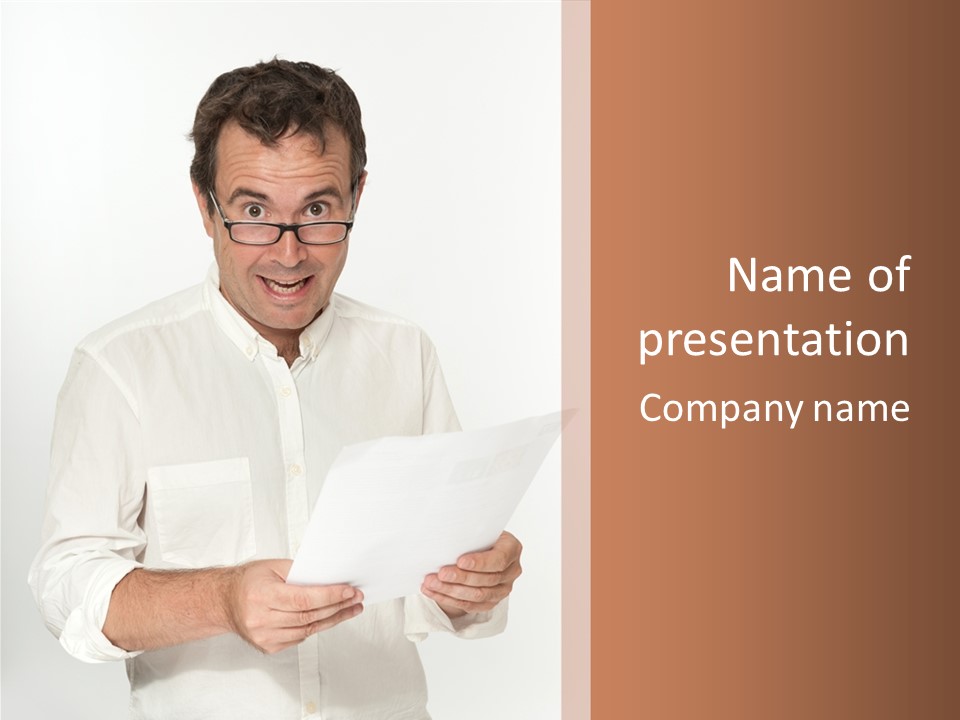 A Man Holding A Piece Of Paper In His Hands PowerPoint Template